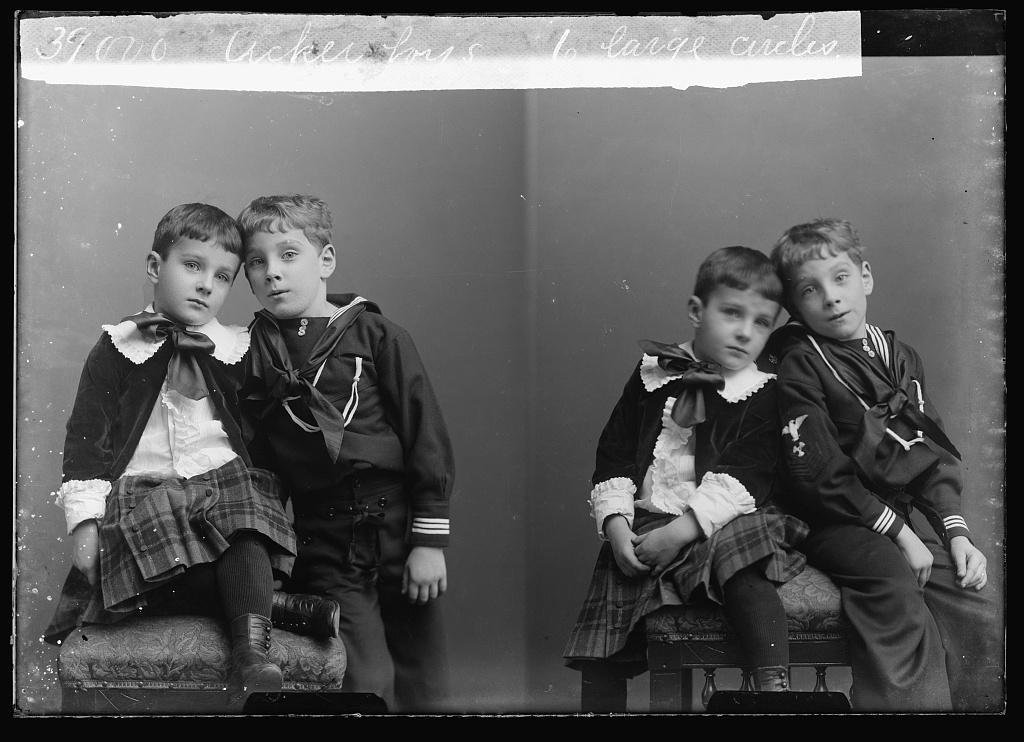 Two poses of two young brothers from the same sitting, identified only as "Acker Boys."