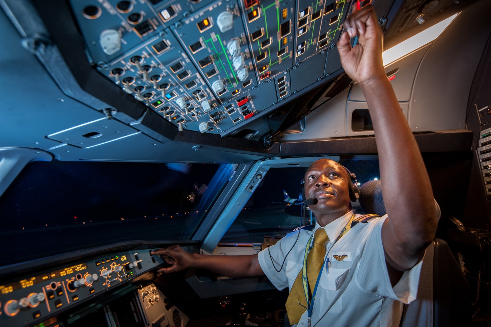 A pilot in the cockpit at Hosea Kutako International Airport, Windhoek, Namibia.
