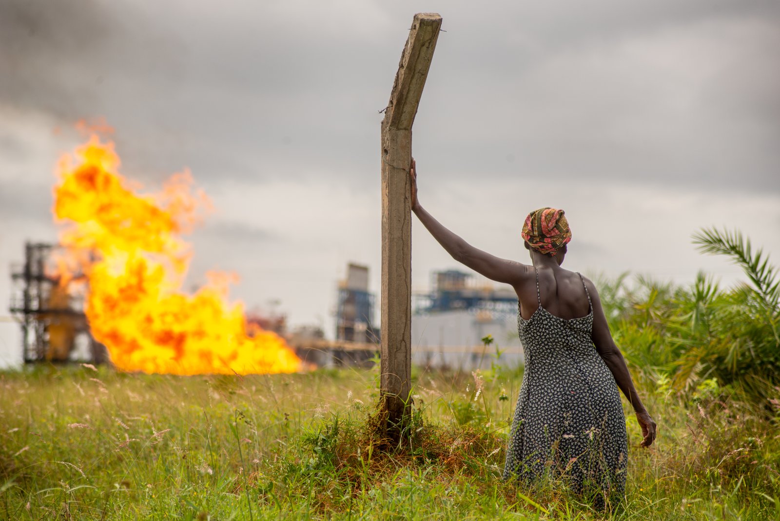 Farmer on her farm beside an oil refinery, Port-Gentil, Gabon.
