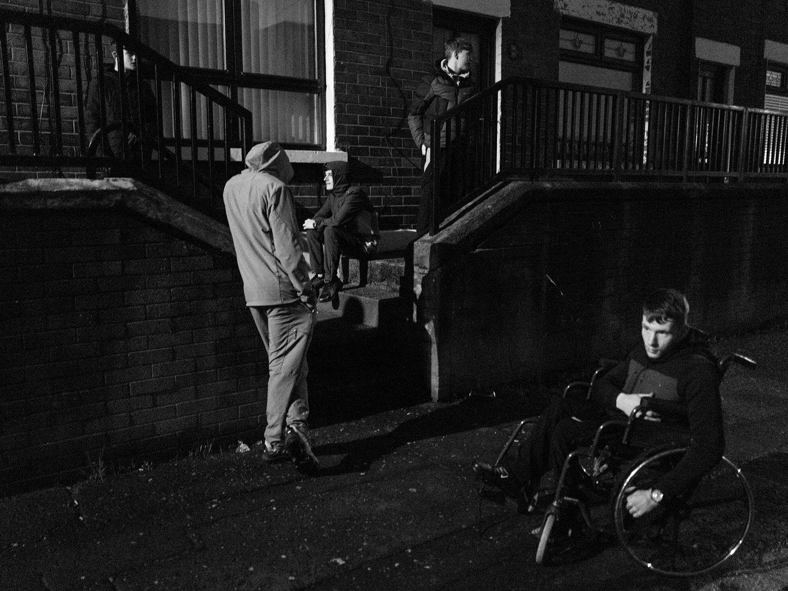 John's friends waiting in front of his house, Belfast, November 2025.