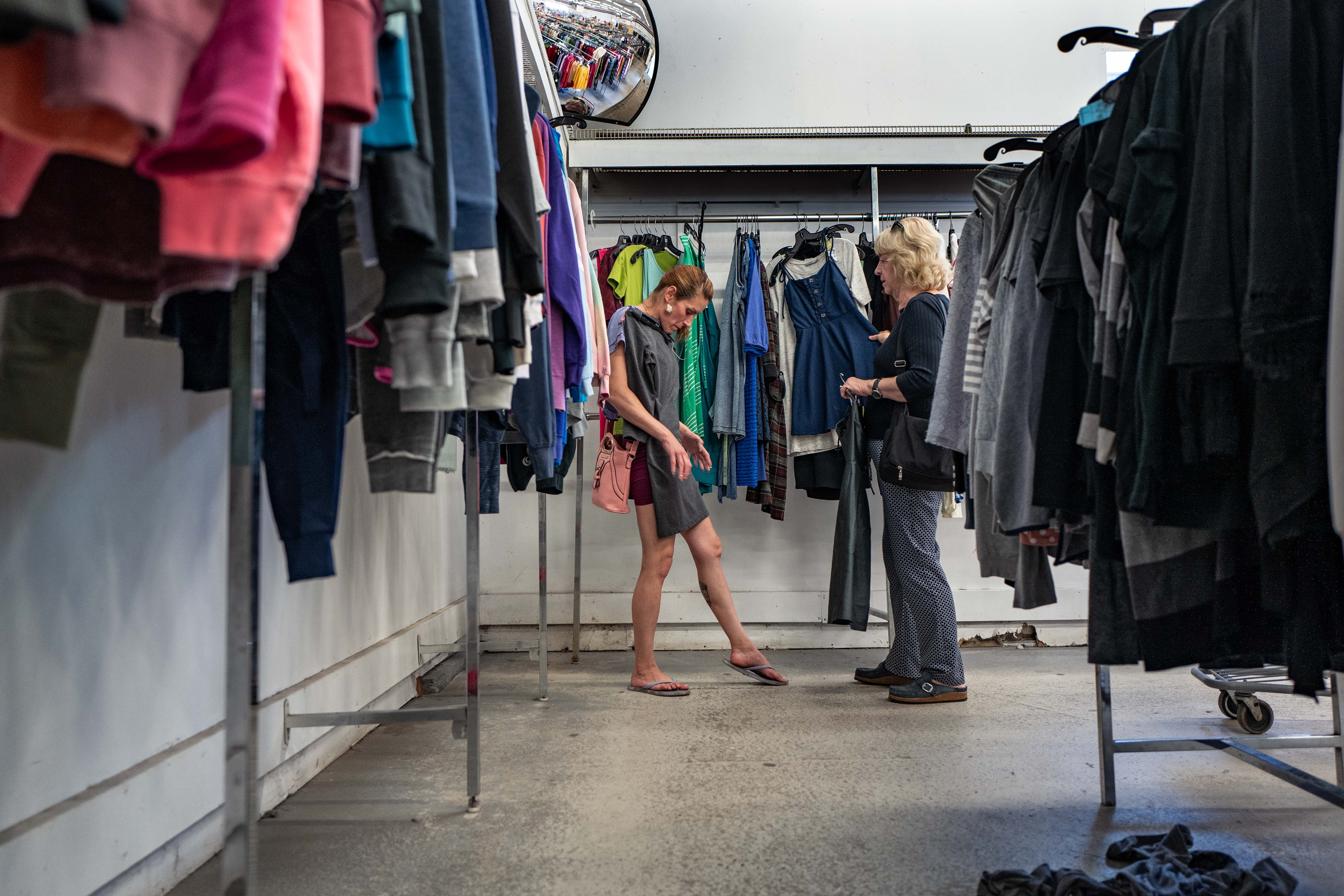 Cary choosing clothes before a panel discussion