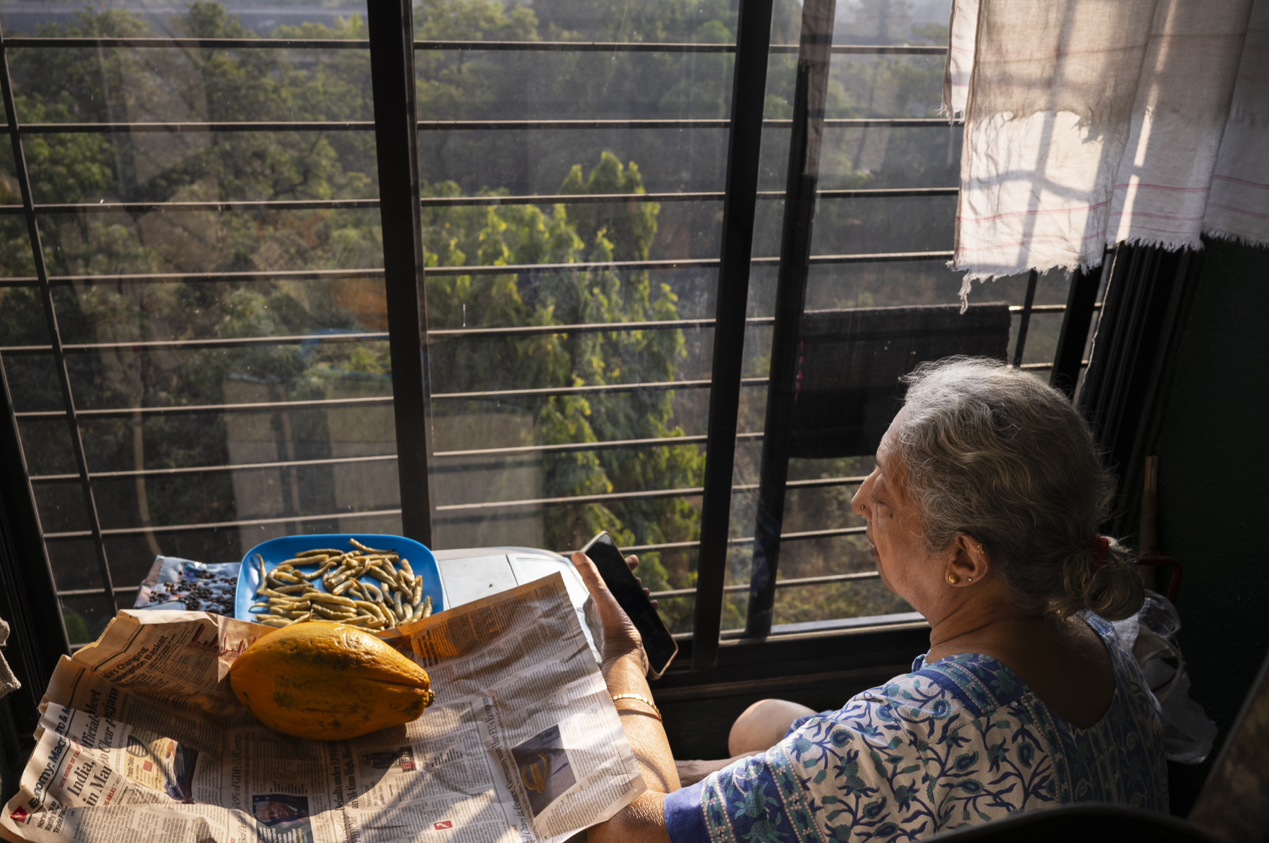 Sharda with phone, Mumbai, 2024