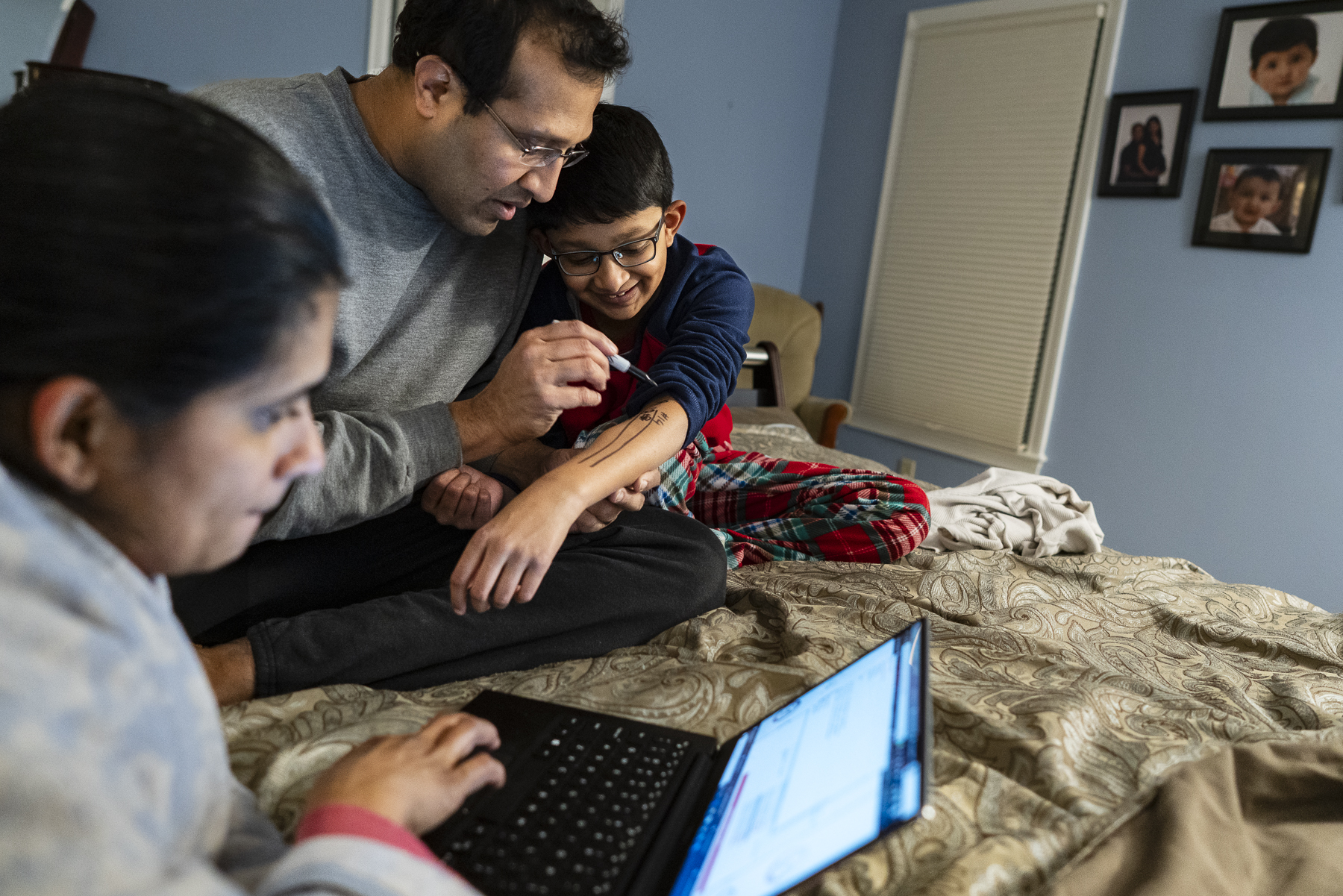 Swim meet ritual: Ajay writing schedule on Neel’s arm, Boston, 2020